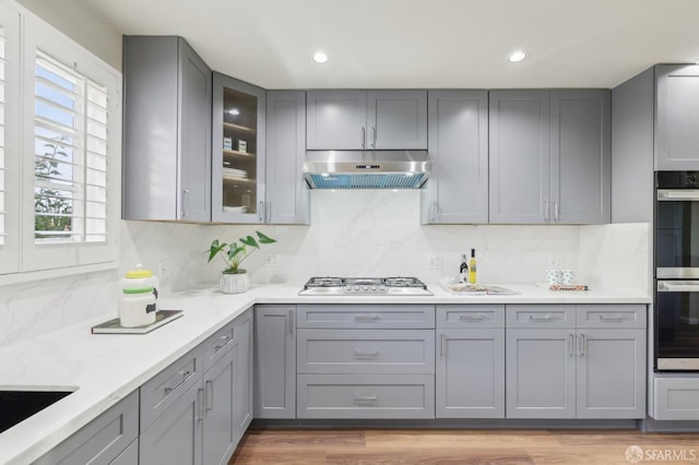 1475 Monterey Blvd, San Francisco, CA 94127 - kitchen featuring gray cabinetry, under cabinet range hood, gas stovetop, backsplash, and recessed lighting