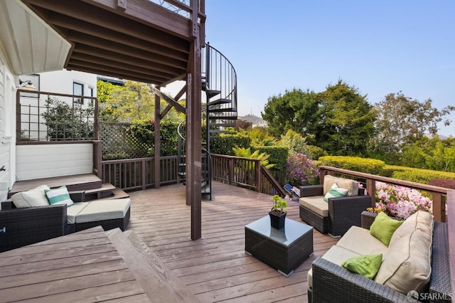 wooden terrace featuring an outdoor living space and stairs