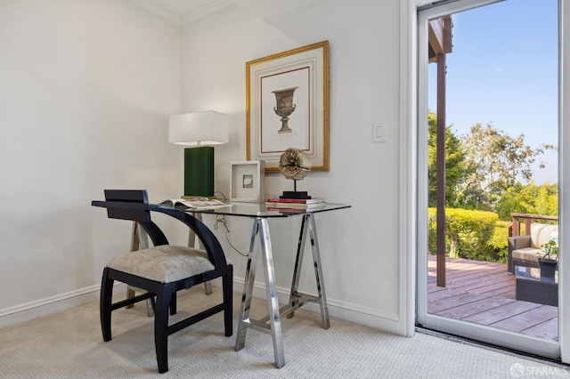 office space featuring baseboards and light colored carpet