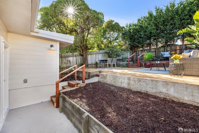 view of yard with an outdoor living space and a patio area