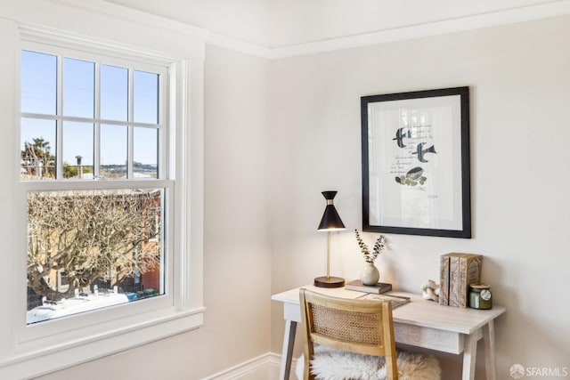 home office featuring crown molding and a wealth of natural light