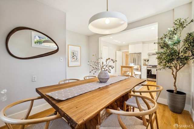 dining room featuring light hardwood / wood-style flooring