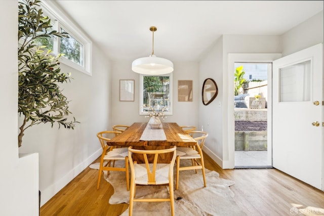 dining space with light wood-type flooring