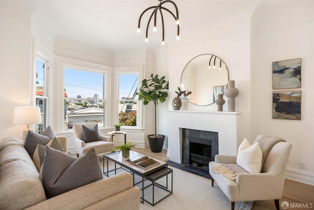 3671 19th St, San Francisco, CA 94110 - living room with wood finished floors, a tile fireplace, and baseboards