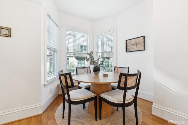 dining room featuring plenty of natural light and light wood-type flooring