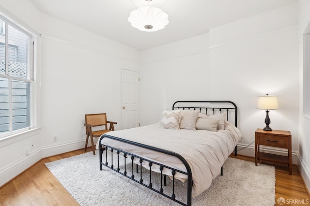 bedroom with hardwood / wood-style flooring