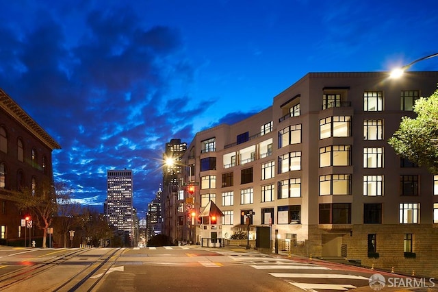 view of outdoor building at dusk