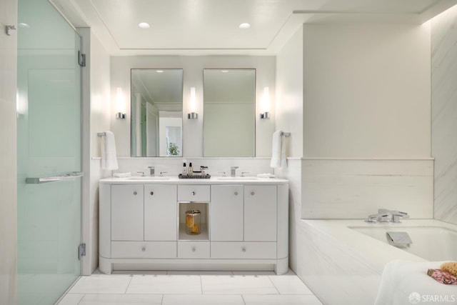 bathroom featuring plus walk in shower, tile patterned flooring, and vanity