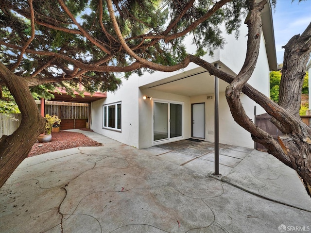 173 Warren Dr, San Francisco, CA 94131 - rear view of property featuring stucco siding and a patio
