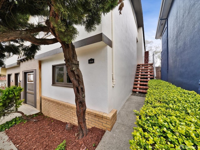 173 Warren Dr, San Francisco, CA 94131 - view of home's exterior featuring stucco siding and stairway