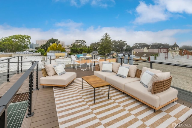 wooden terrace featuring an outdoor living space