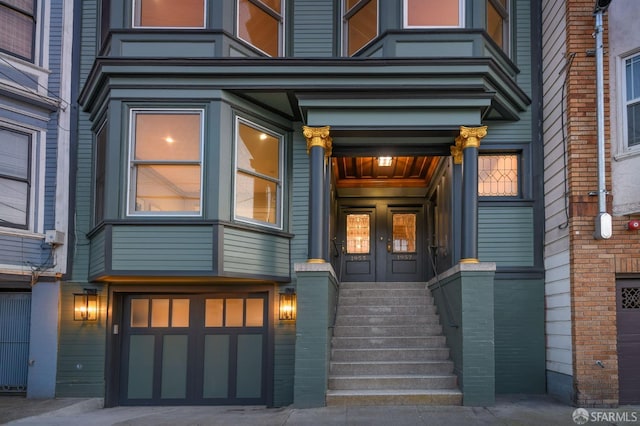 doorway to property featuring a garage