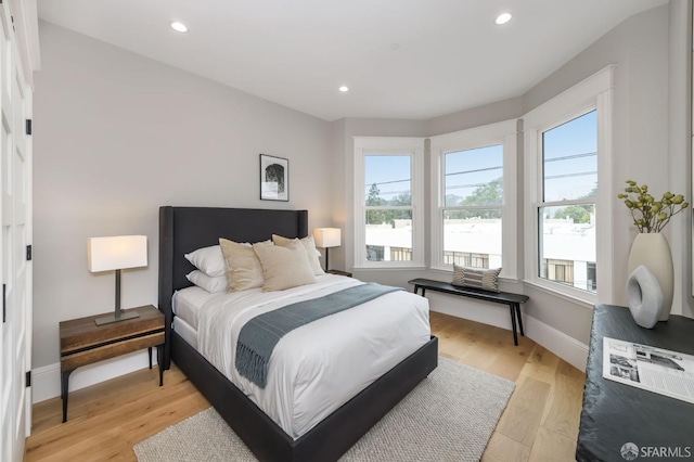 bedroom with light hardwood / wood-style flooring