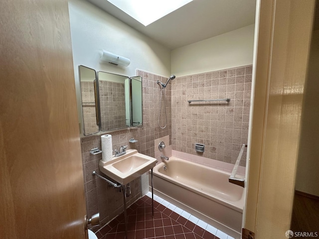 bathroom with sink, tile patterned flooring, and tiled shower / bath combo