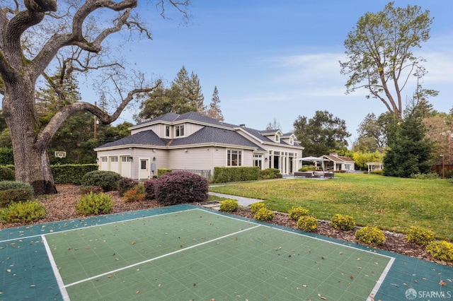 view of basketball court featuring a lawn