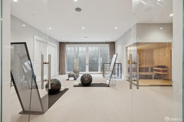 exercise room with carpet flooring and french doors