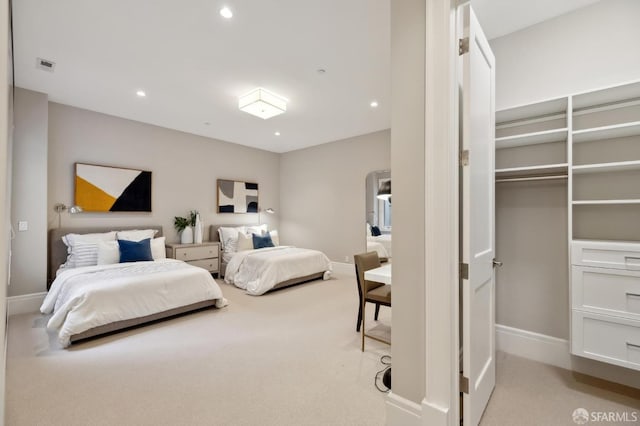 bedroom featuring light carpet