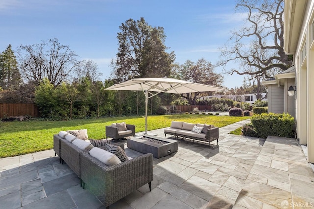 view of patio / terrace featuring an outdoor living space with a fire pit