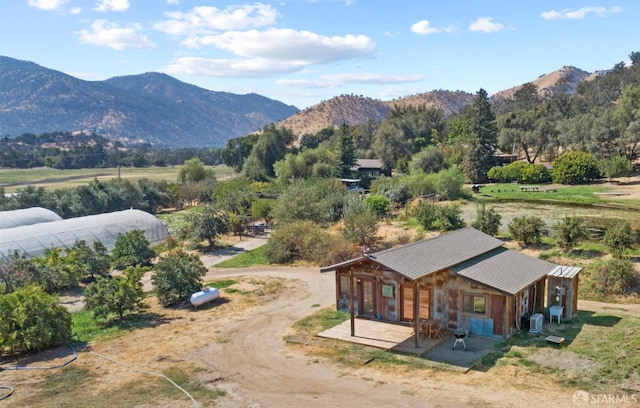 birds eye view of property with a mountain view