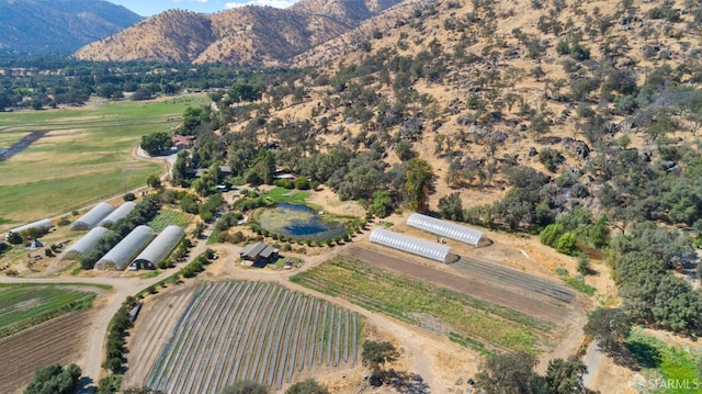 drone / aerial view featuring a rural view and a mountain view