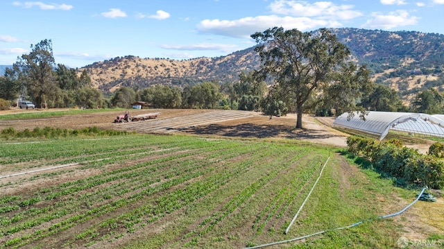 view of mountain feature with a rural view