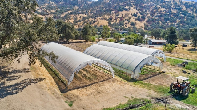 birds eye view of property with a rural view and a mountain view