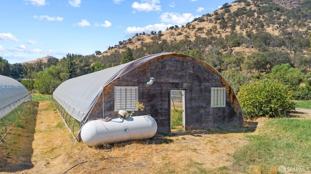 view of outbuilding with a mountain view