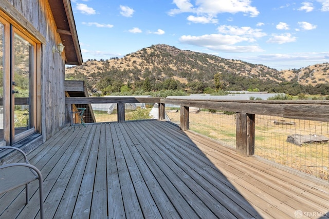 wooden deck featuring a mountain view