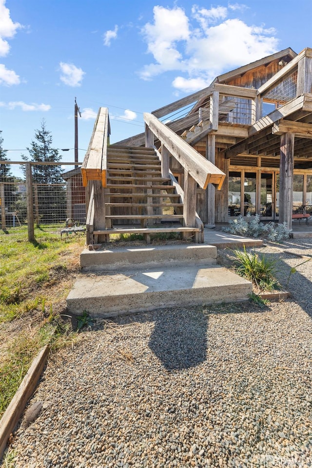 view of home's community featuring stairway