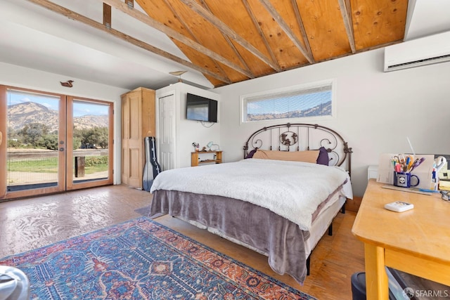 bedroom with an AC wall unit, access to outside, vaulted ceiling with beams, a mountain view, and french doors