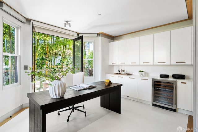 home office with plenty of natural light and beverage cooler