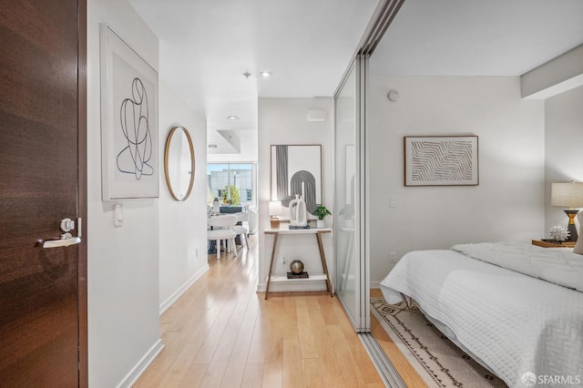 bedroom with light hardwood / wood-style floors