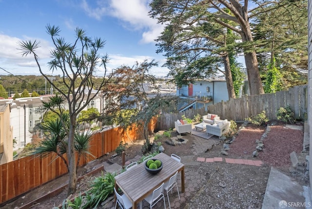 view of yard with a fenced backyard, an outdoor hangout area, and a patio