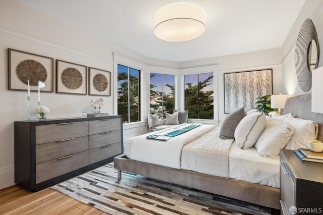 bedroom with light wood-style floors