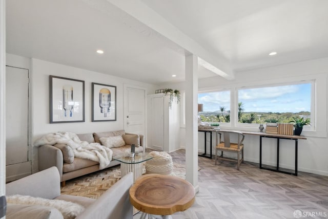 living room with baseboards, beamed ceiling, and recessed lighting