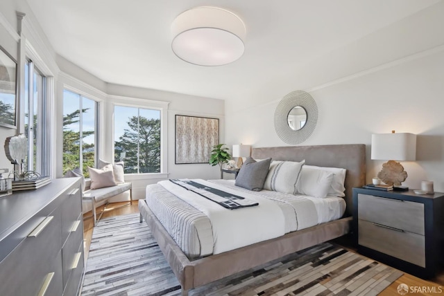 bedroom featuring light wood-style floors