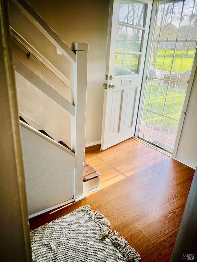 22 NE Selfridge St, Vallejo, CA 94590 - doorway featuring wood finished floors, baseboards, and stairway
