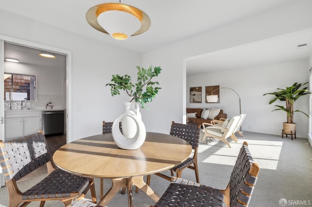 view of carpeted dining area