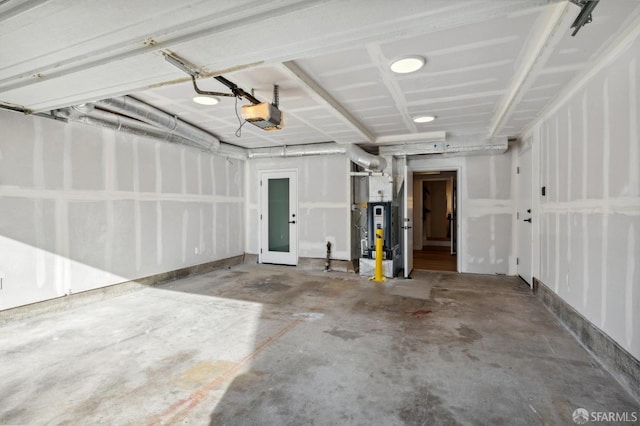 garage featuring a garage door opener and water heater