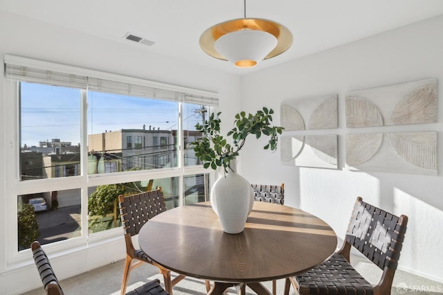 view of carpeted dining space