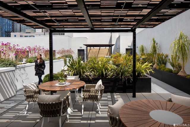 1288 Howard St Unit 101, San Francisco, CA 94103 - view of patio / terrace with a pergola and outdoor dining area