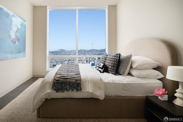 488 Folsom St Unit 5501, San Francisco, CA 94105 - bedroom with floor to ceiling windows, a mountain view, wood finished floors, and baseboards