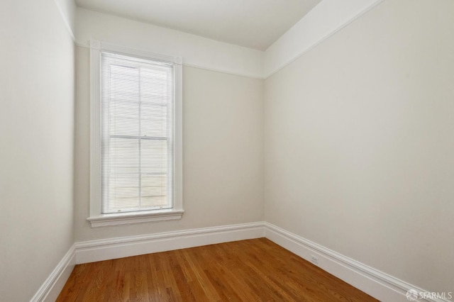 empty room with wood-type flooring