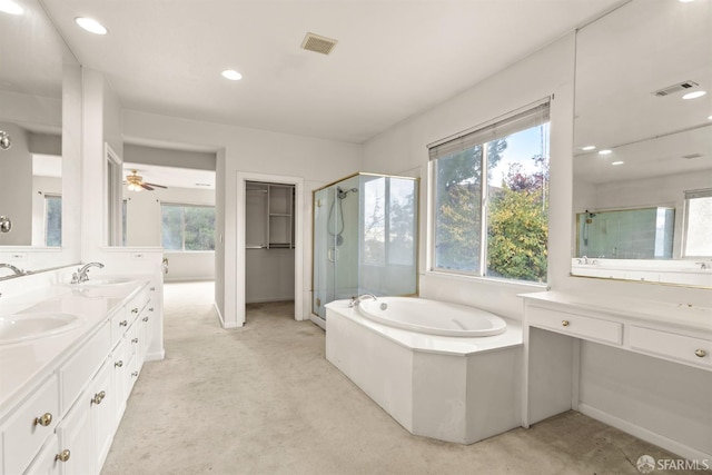 bathroom with shower with separate bathtub, vanity, and ceiling fan