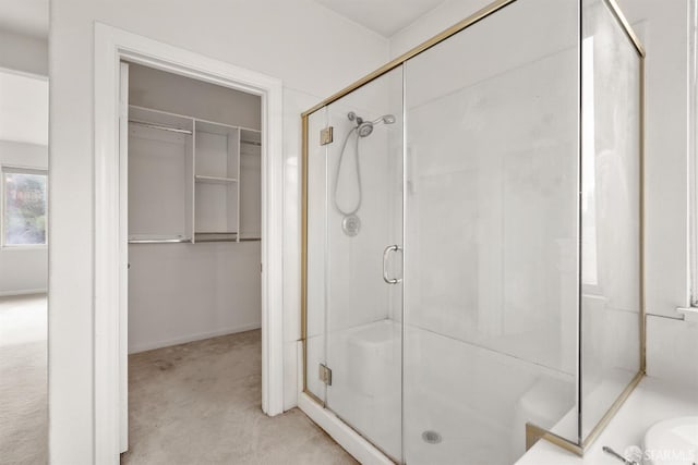 bathroom with a shower with door