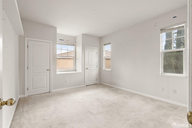 empty room featuring light carpet