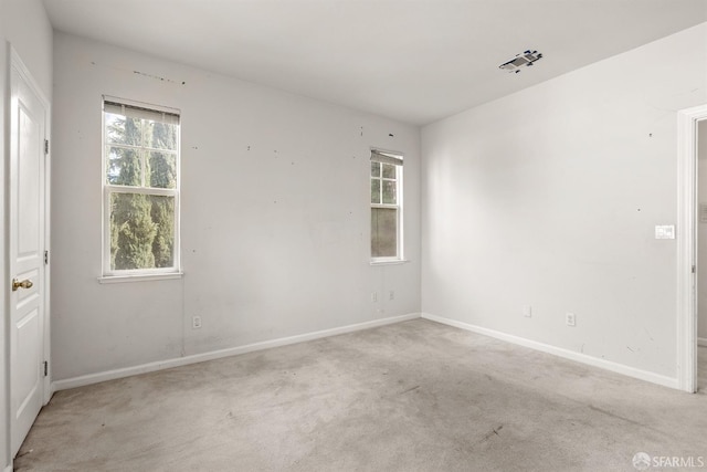 empty room featuring light colored carpet