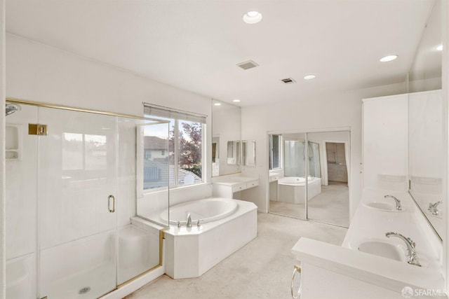 bathroom with vanity and separate shower and tub