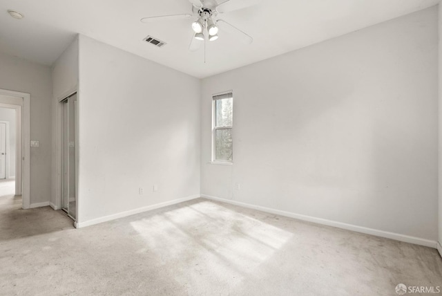 carpeted empty room with ceiling fan