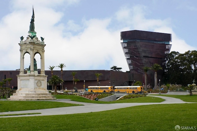 view of property's community with a lawn